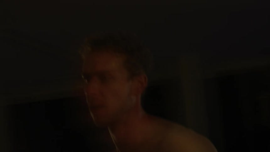 A man is jogging in the dark room