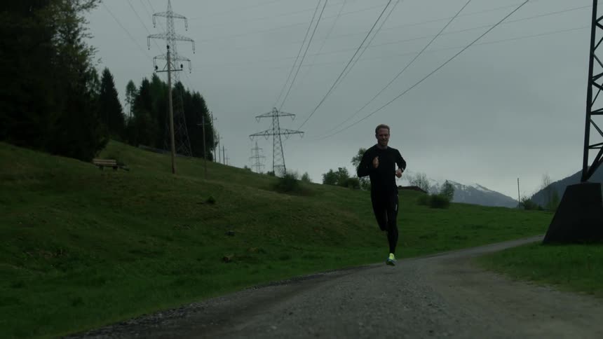 A man jogs down a pathway