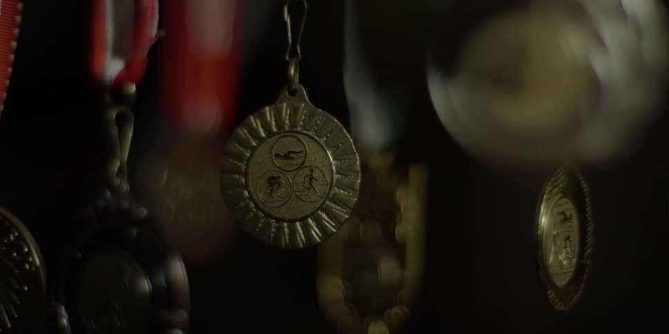 The medals are hanging in the dark case