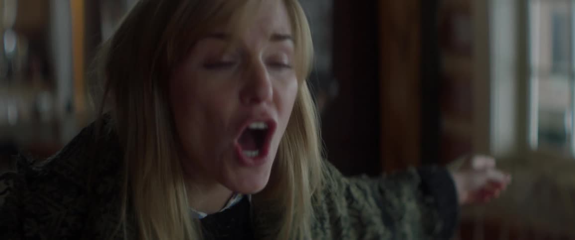 A woman is yelling at someone in the home