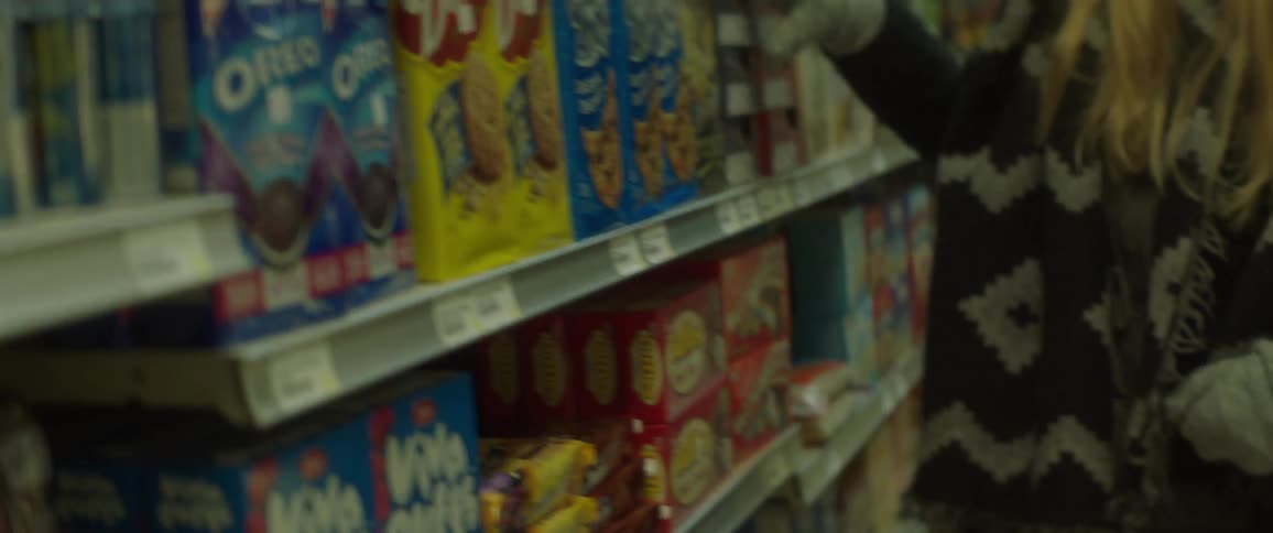 A woman is looking at the items in the store