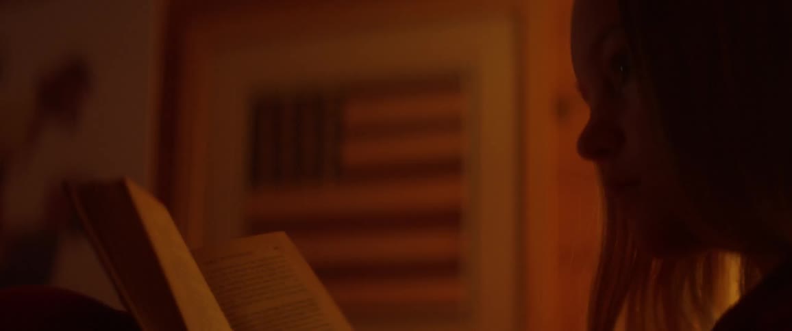 A person turns the page of a book they are reading