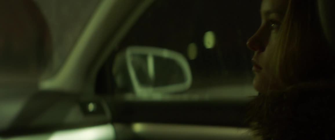 A girl rides in a car