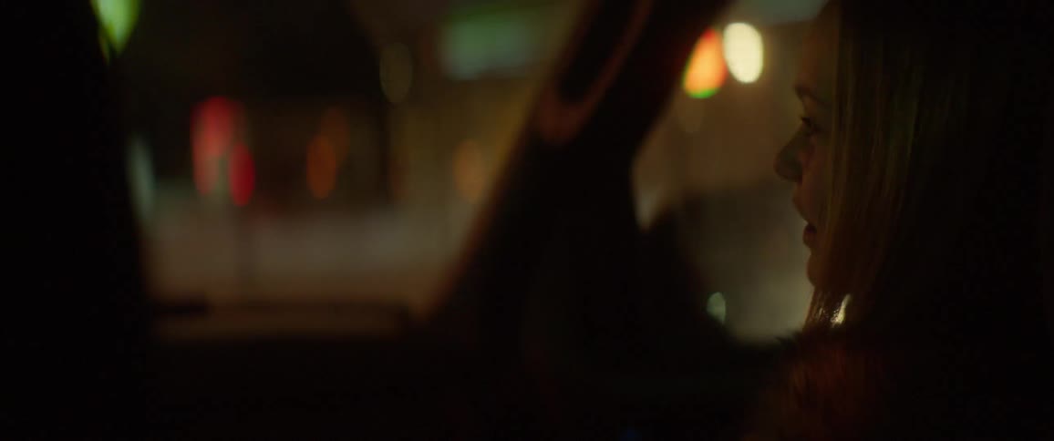 A girl rides in a car