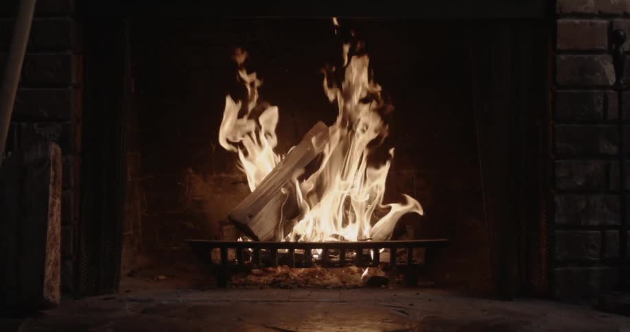 A fireplace with a roaring fire