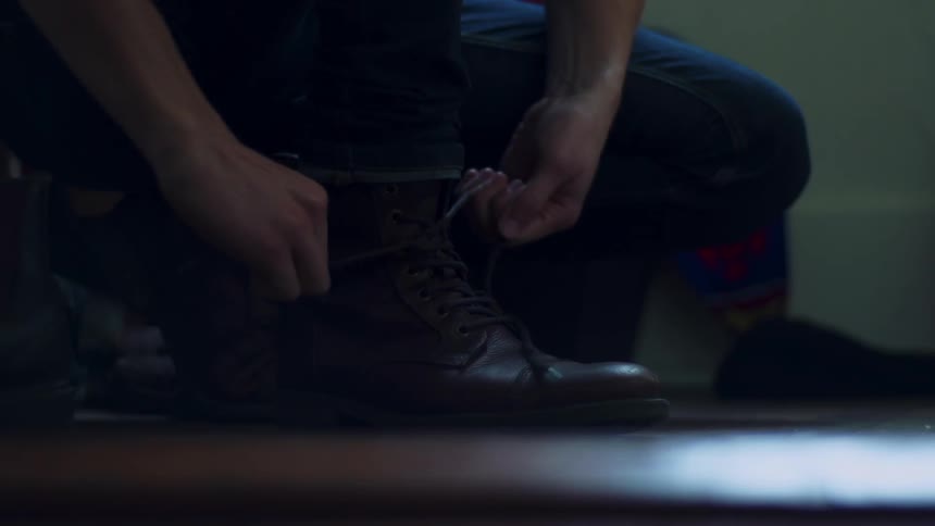 A person ties their shoe