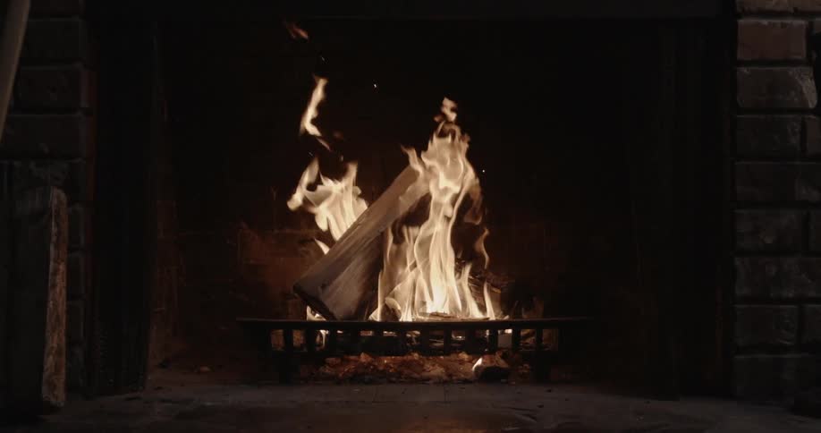 A fire burns in a fireplace
