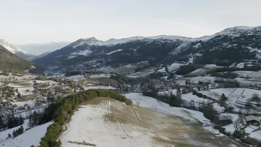 Flying over a valley covered in snow