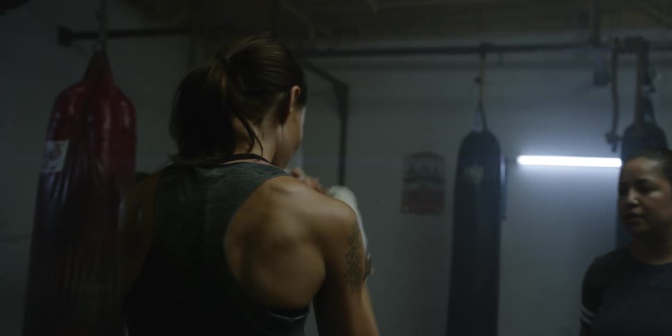 A woman trains in the gym