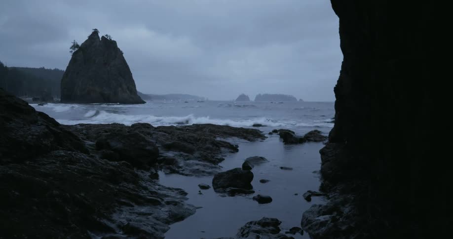 Ocean waves crash into a rocky shore