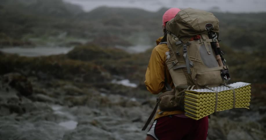 Person hikes over bumpy terrain