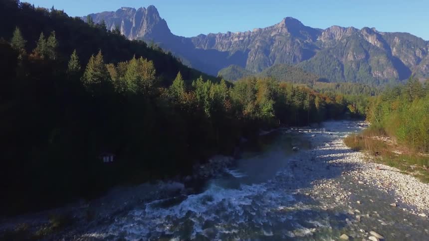 Fast moving river flows over rocks