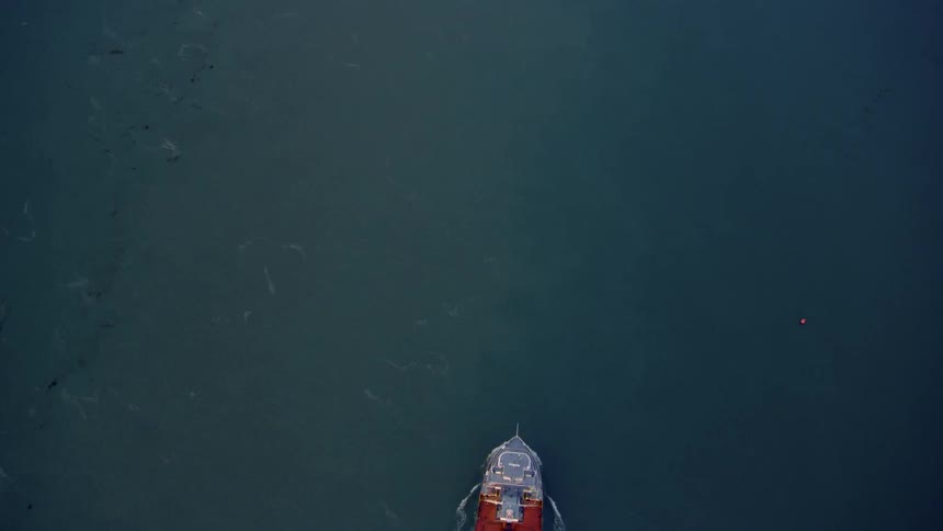 Boat floats on a large body of water