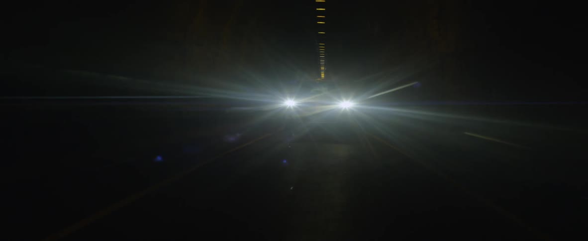 Cars drive through a tunnel