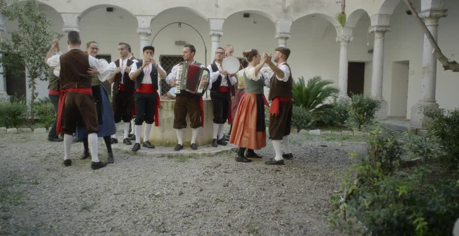 People dance to live music in a village
