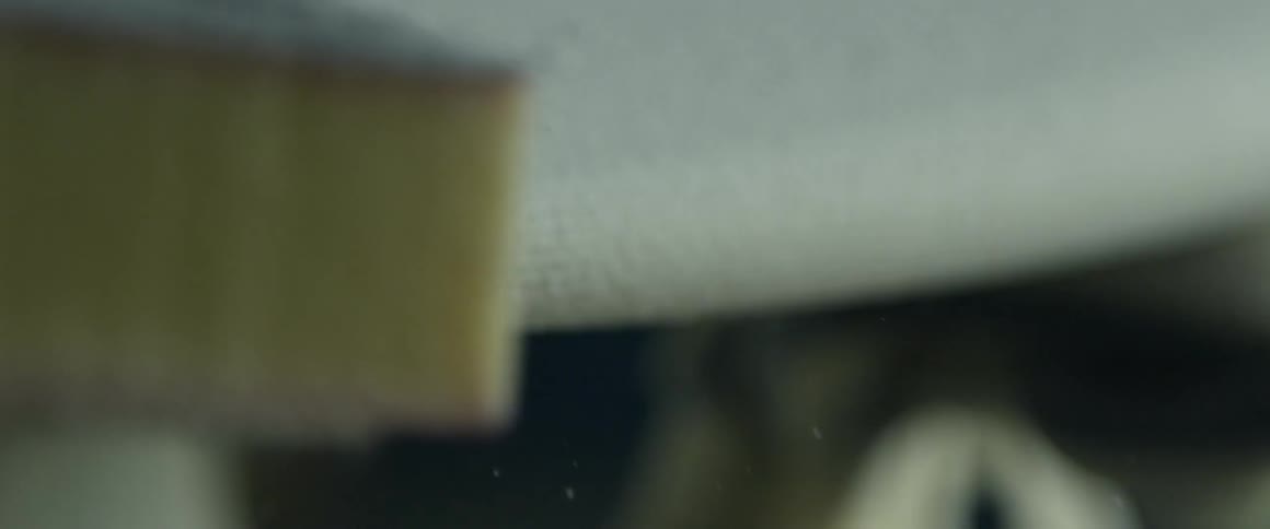 A man is making a surfboard