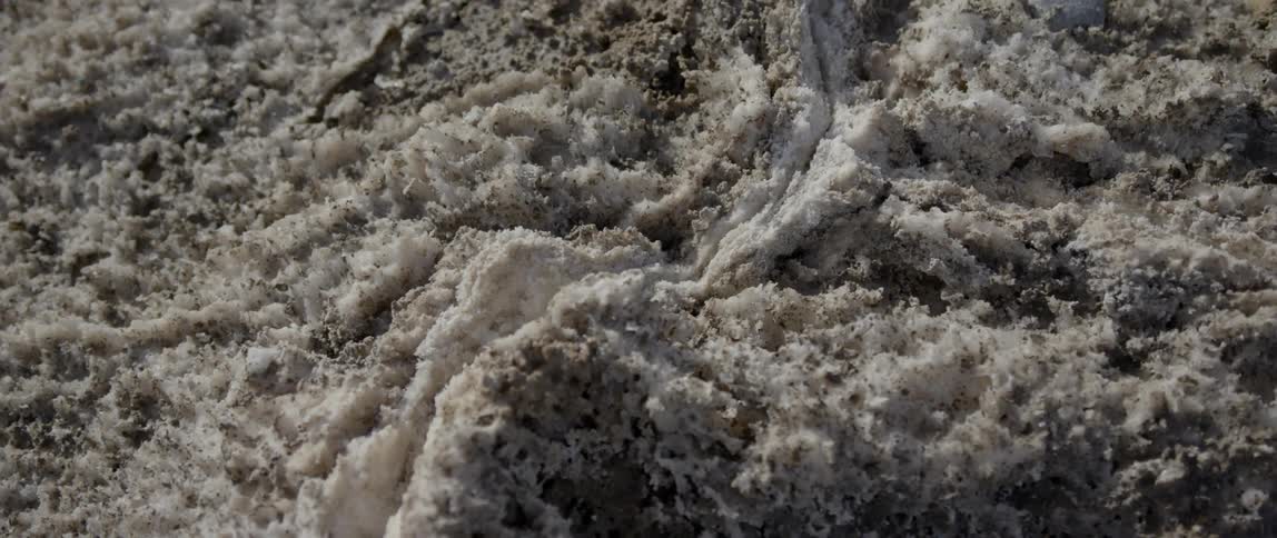 Ice and snow mixed in with dirt and rock