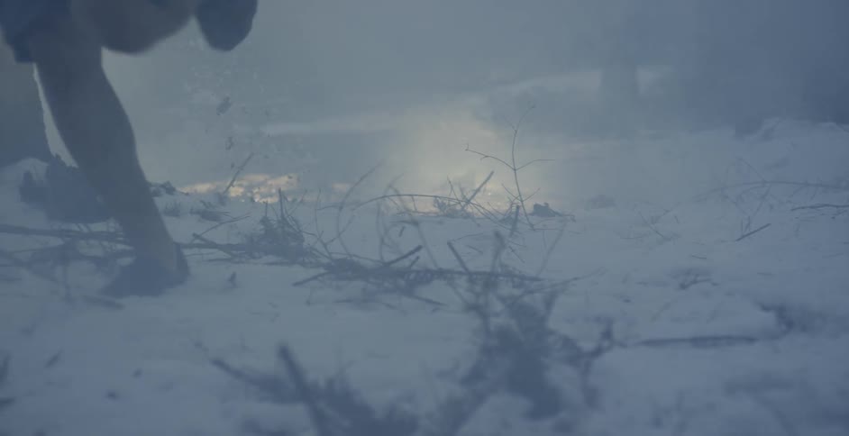 A man runs over snowy ground