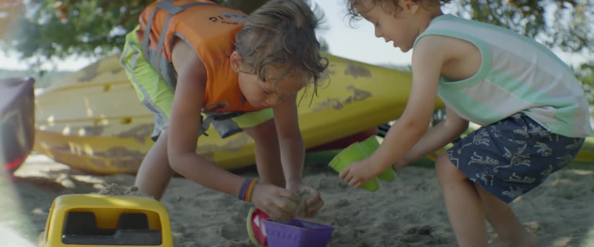 Children play in the sand together