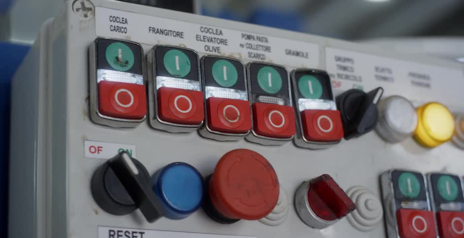 The machine has many knobs and buttons with labels