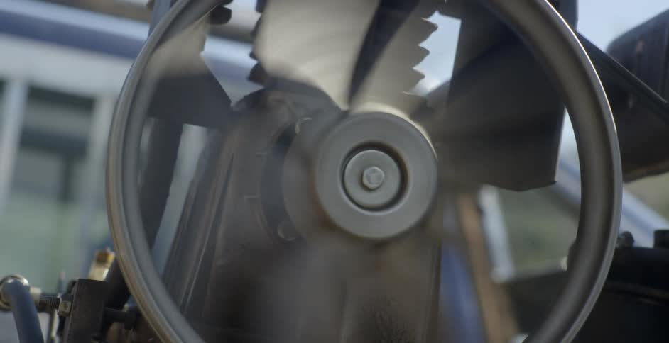 A motor spins a wheel inside a warehouse
