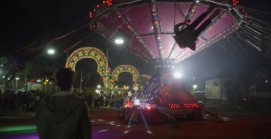 People ride an amusement park ride