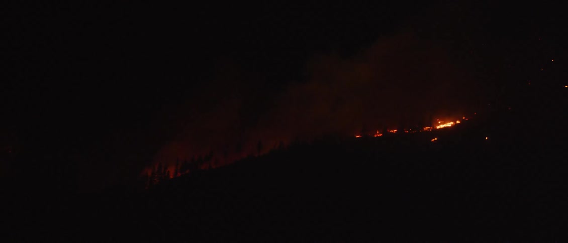 The hills are smoking and on fire at night