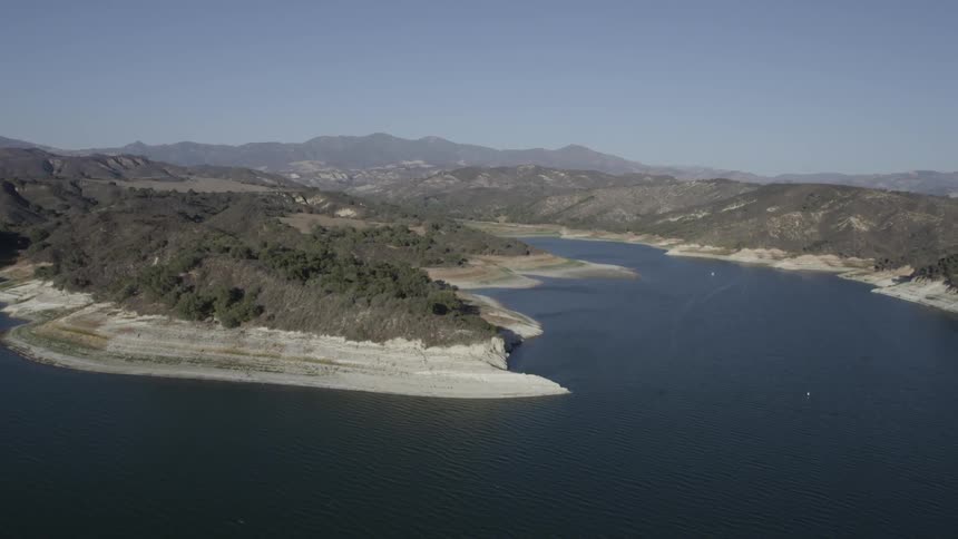 An ocean forms a bay along a coastline