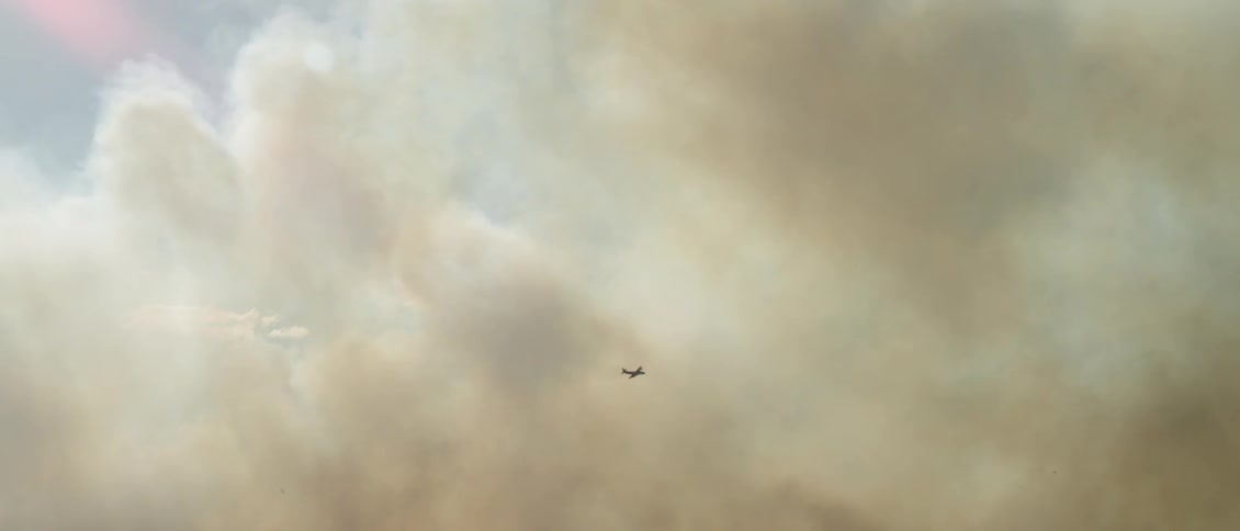Smoke is rising up from a wildfire