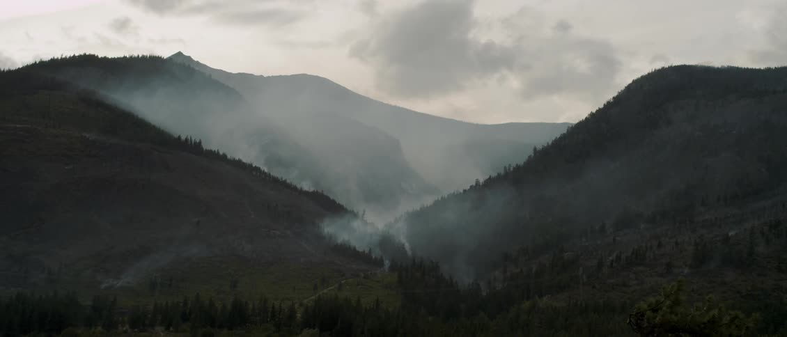 Haze and smoke lift off of the mountain valley