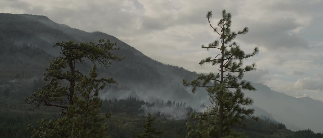 The smoke is rolling down the windy hills