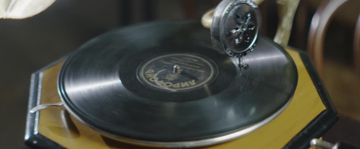 A vinyl record spins on a record player
