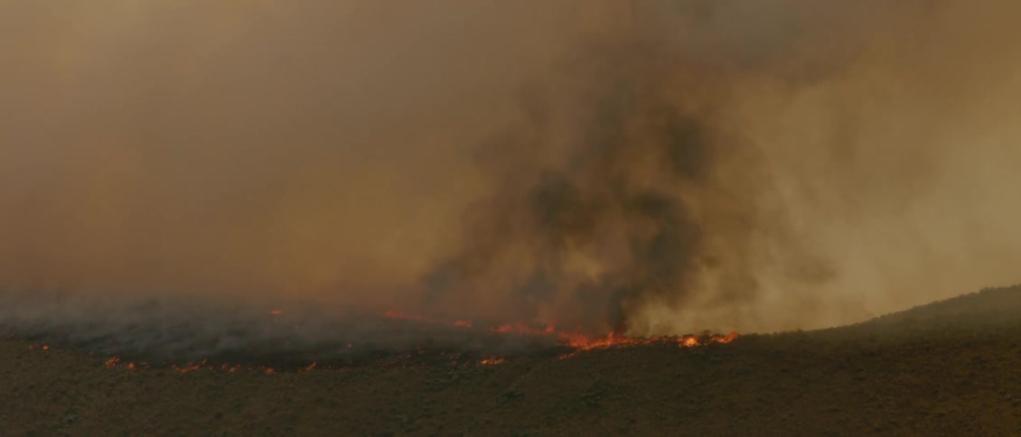 A fire burns on the plains