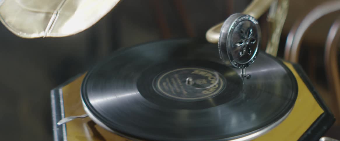 A record is spinning on a gramophone