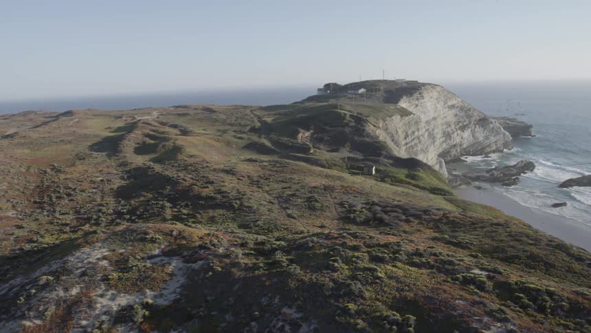 An aerial view of oceanside cliffs