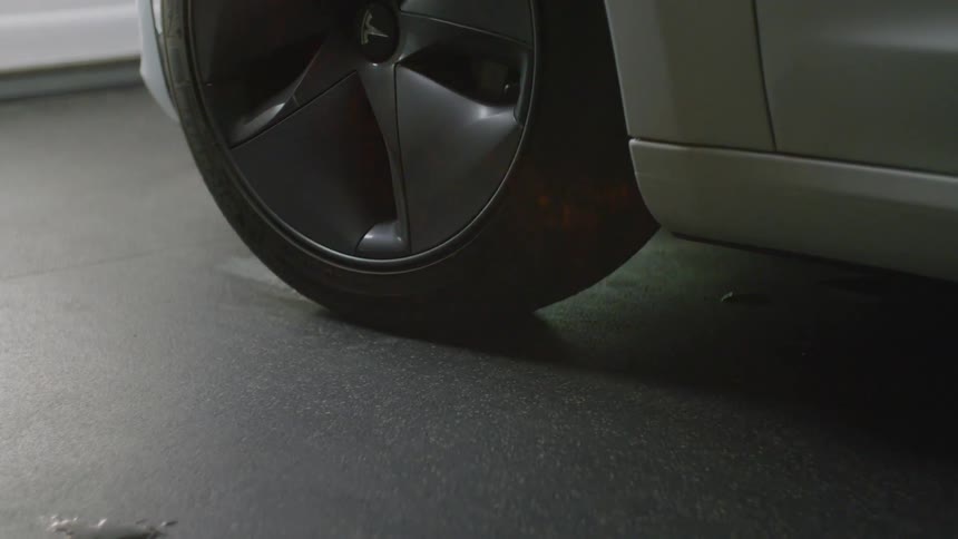 Car wheel turns and the car pulls forward