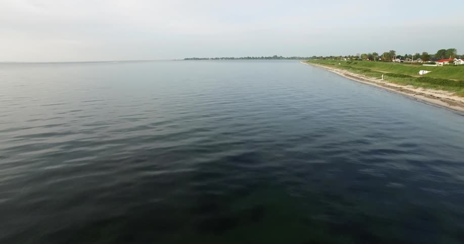 The water slowly hits the shore of this town