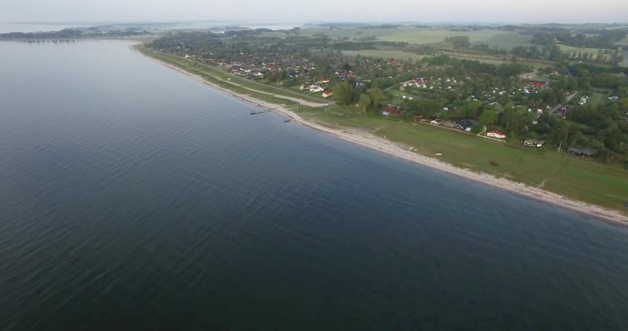 The water flows along the shore