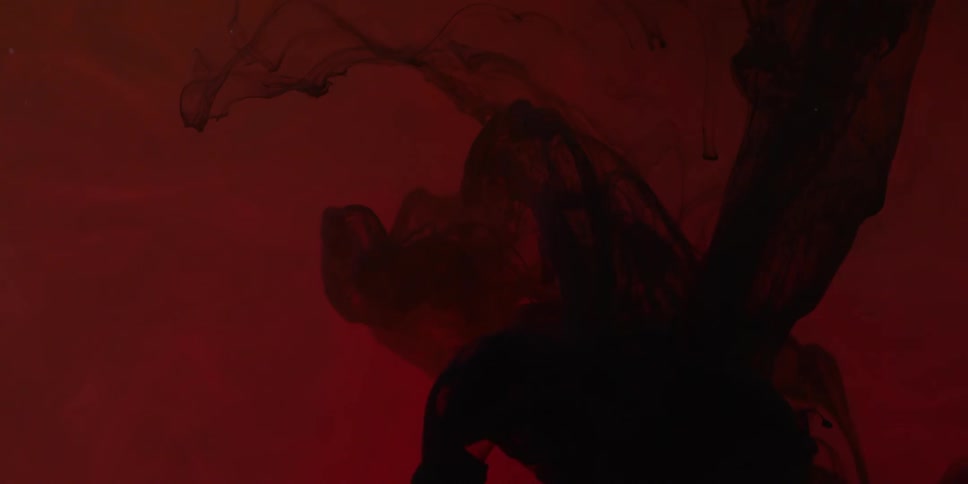 Lacy substance floats in the red water