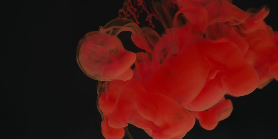 Red dye swirls in water