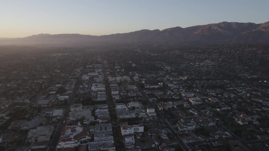 A city is shown at dusk