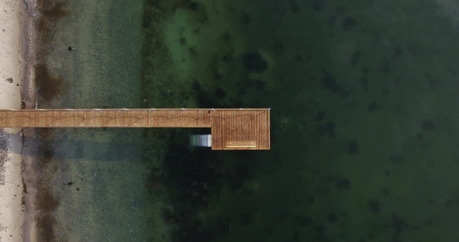 Long wooden dock in the ocean