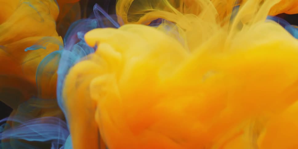 Multiple colors of smoke are swirling around