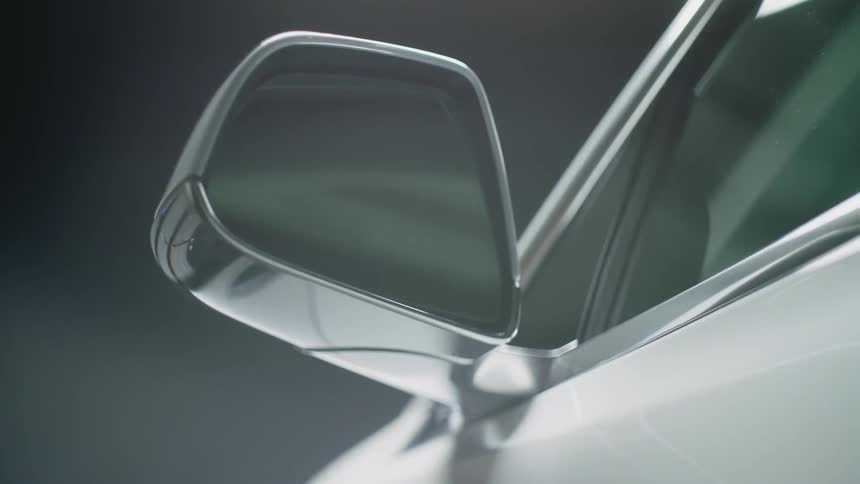 Side mirror rotates outwards from a vehicle