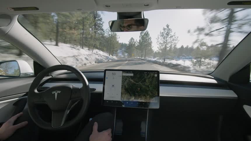 Car drives itself down a snowy road