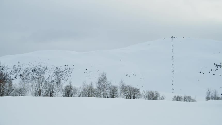 Snow covers the mountain