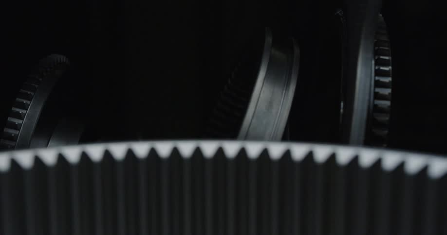 A light shines on metal equipment in the dark
