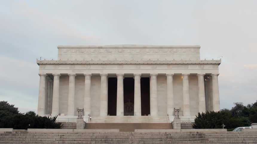 People walk by and visit the lincoln memorial