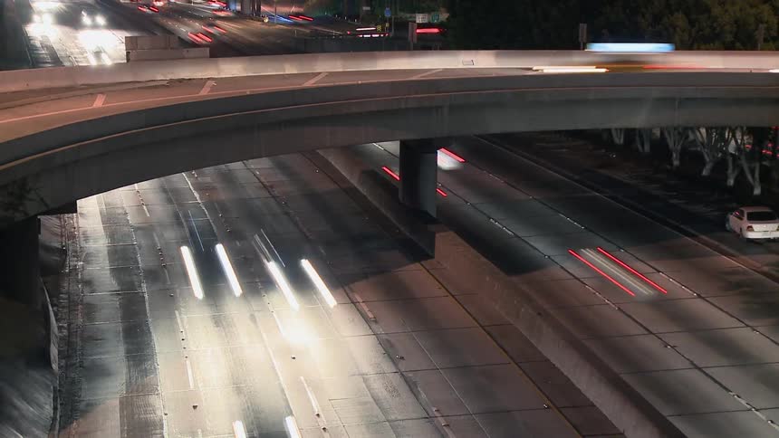 Cars travel on a busy road