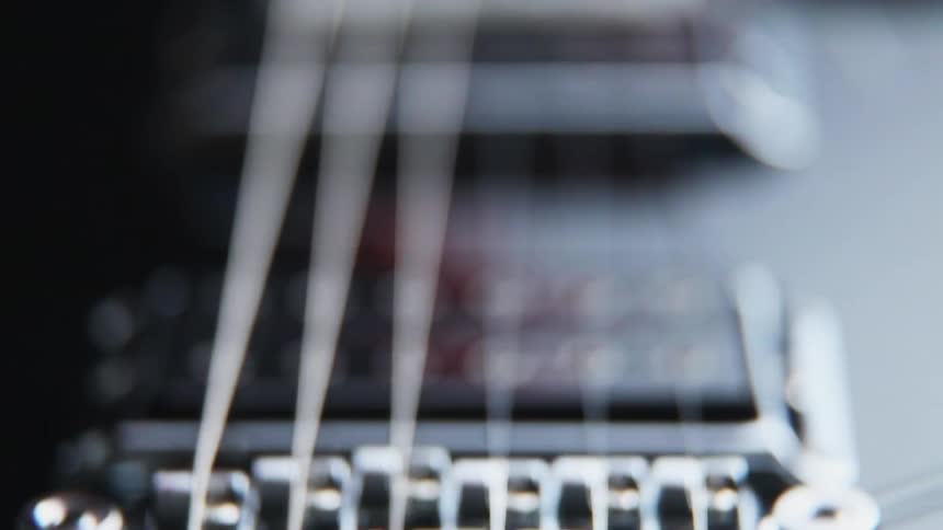 A guitar slowly comes into focus